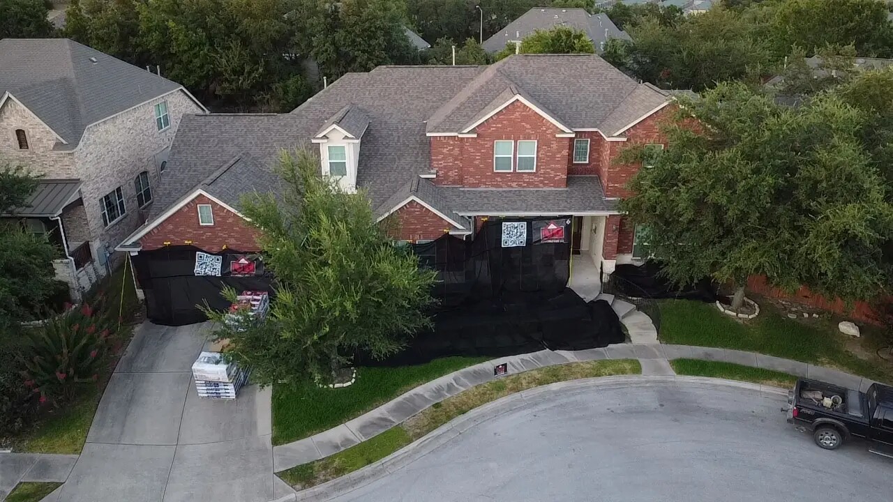 Brick home with an asphalt-shingle roof