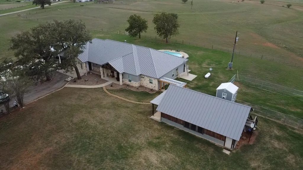 Large home with a gray metal roof