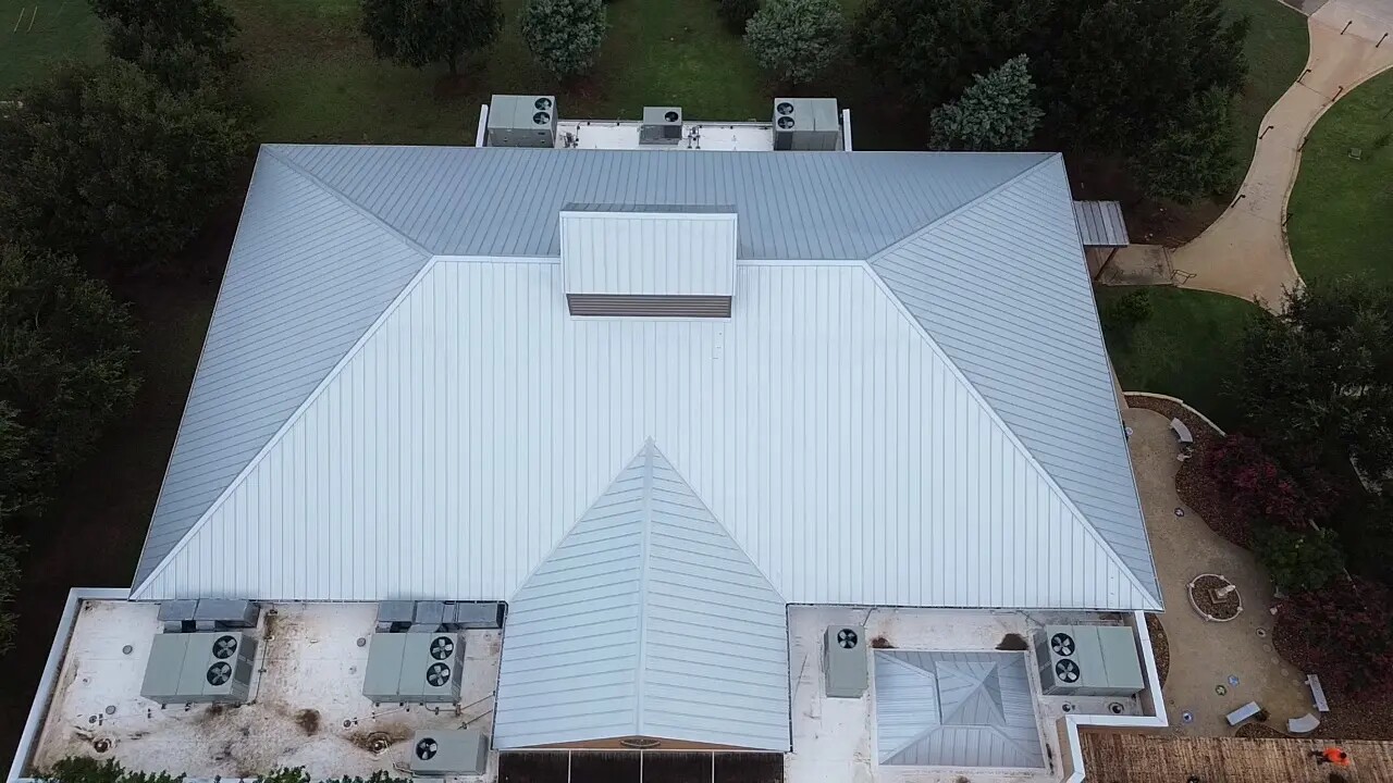 Home with a white metal roof