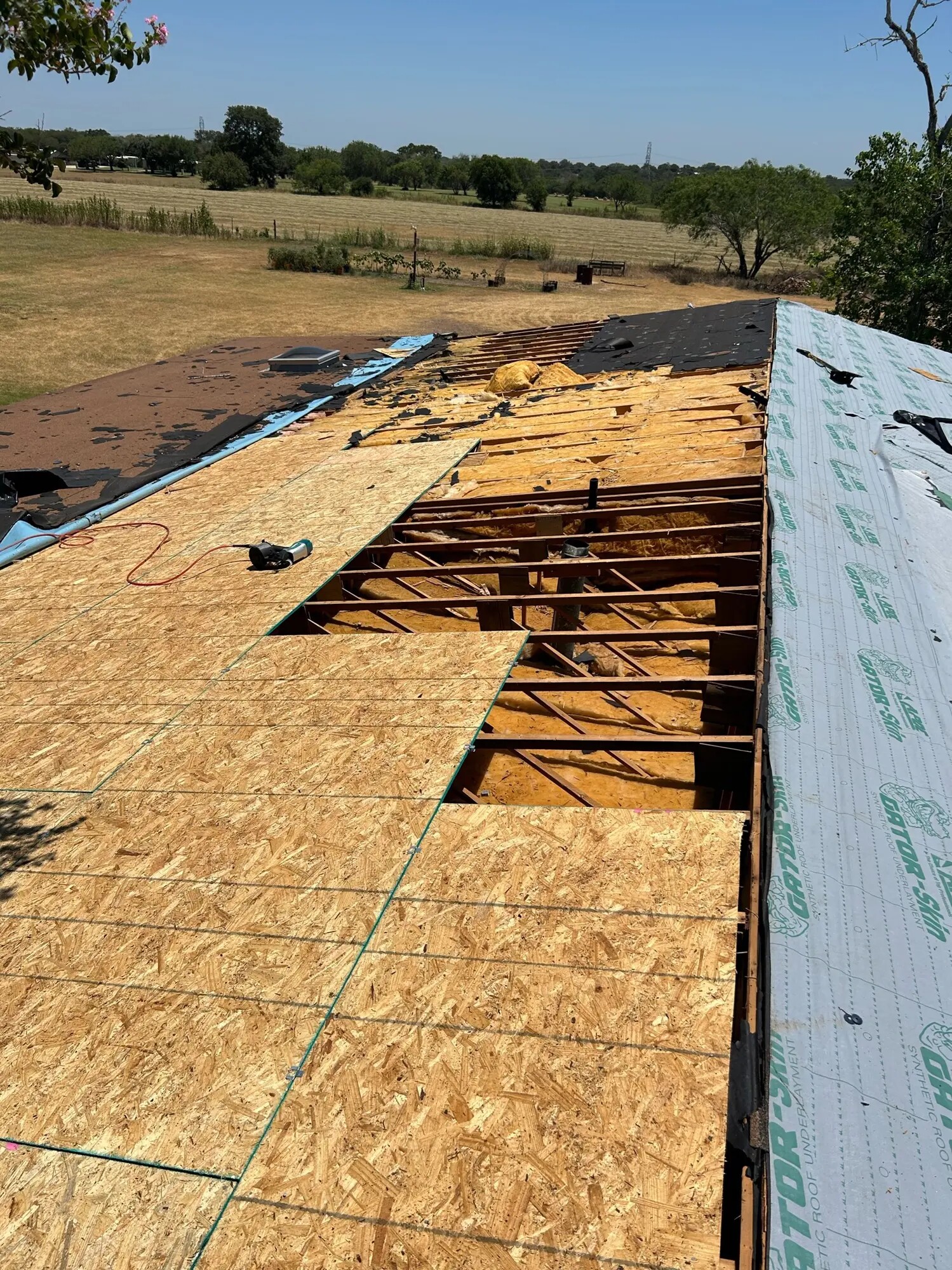 Exposed roof framing during roof-deck work