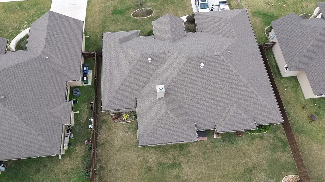 Suburban home gray shingle aerial